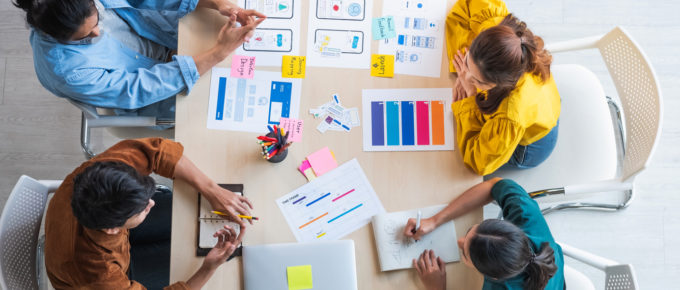 Diverse employees brainstorming in an office about creating and innovative culture